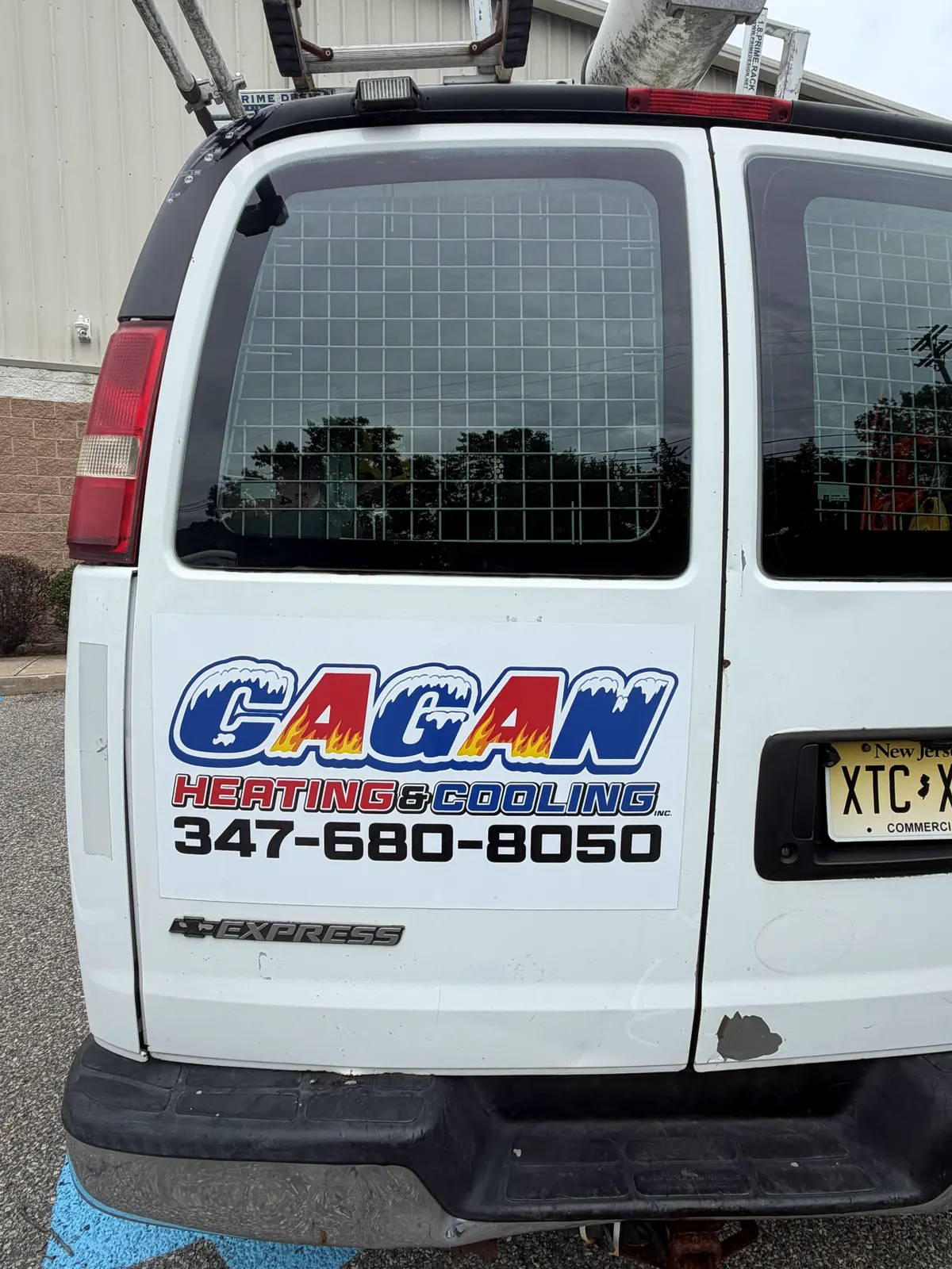 GAGAN HEATING & COOLING lettering — rear door
