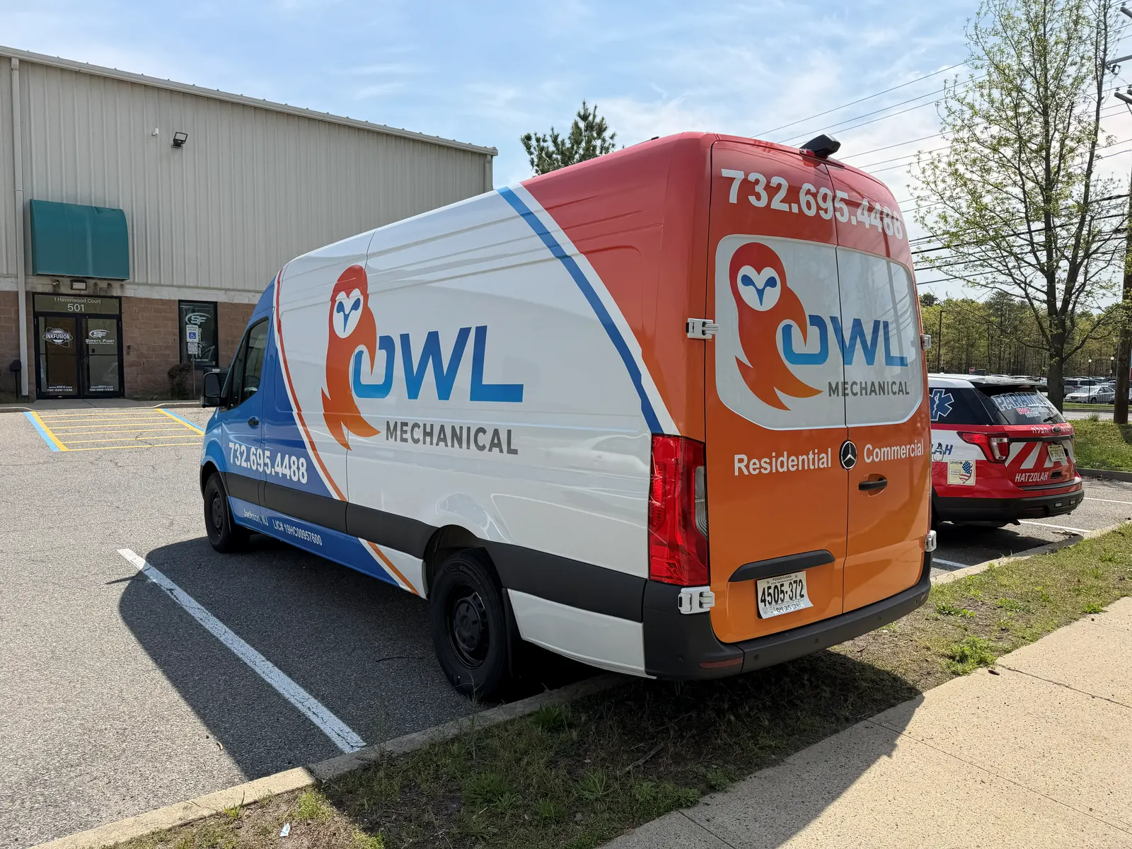OWL MECHANICAL full wrap — rear three-quarter
